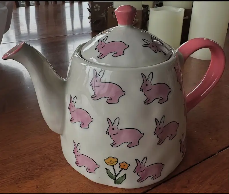 White teakettle with pink bunnies on it