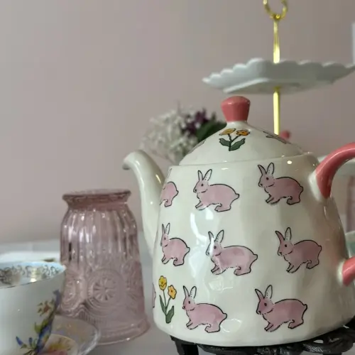 White tea kettle with pink bunnies on it | Honey Bunny’s Tea House